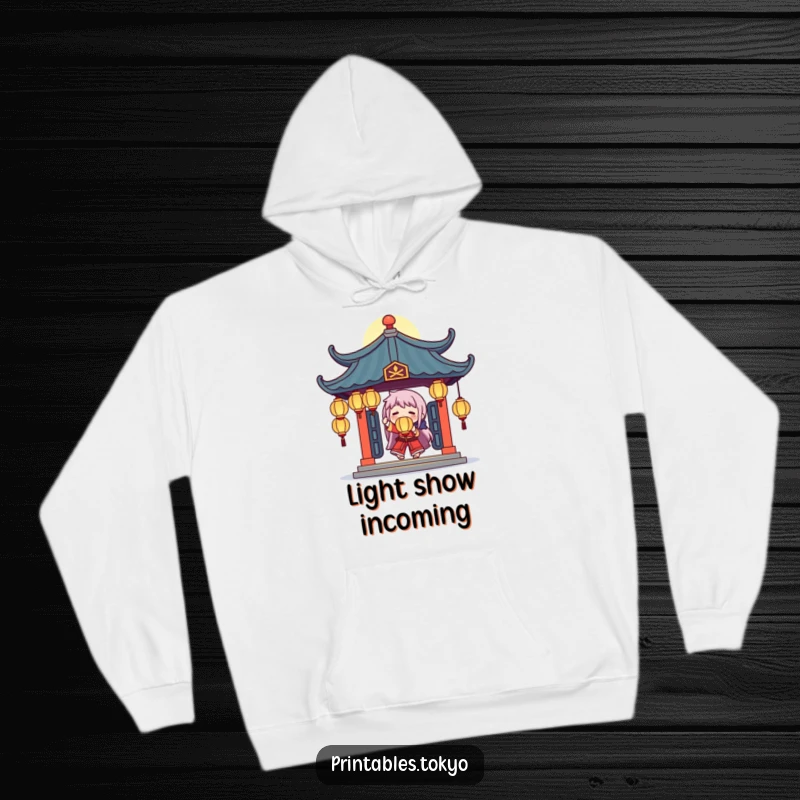 Funny hoodie with a character juggling glowing lanterns under a stylized temple roof, creating a warm and humorous atmosphere.