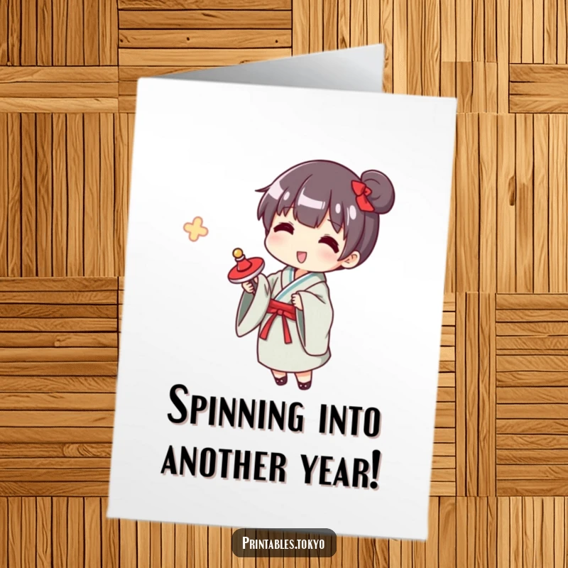 Funny Free Printable Birthday Card: Character in a small yukata happily spinning a traditional spinning top, full of playful energy.